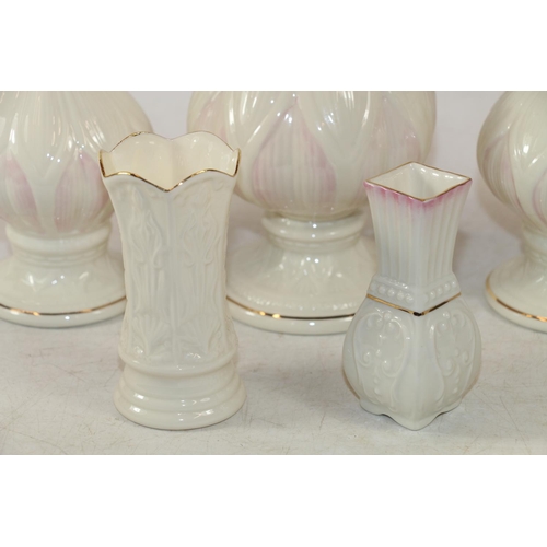 293 - Five Belleek vases, largest 20cm high.