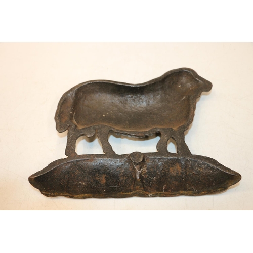 191 - Late 19th century cast iron ram, 26cm wide.