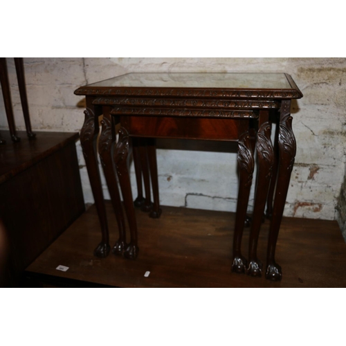 683 - Nest of three mahogany tables with glass tops, raised on cabriole legs terminating in claw and ball ... 