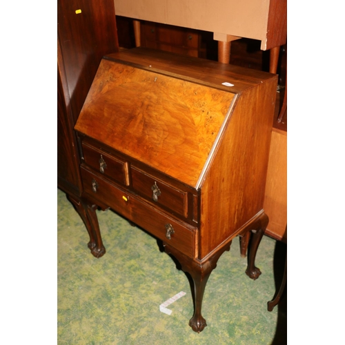 686 - Figured walnut bureau fall front above two short over one long drawers, raised on cabriole legs term... 