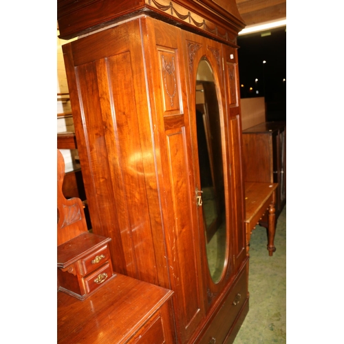 690 - Early 20th century mahogany wardrobe with single glazed door over drawer, decorated with bows and sw... 
