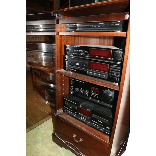 694 - Music cabinet containing a Technics stereo tuner, CD players, amplifiers, etc., and two speakers.