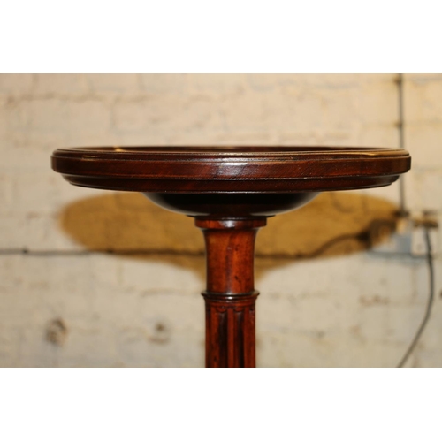 695 - Large mahogany torchere, fluted and block column over four pad feet, 160cm high.