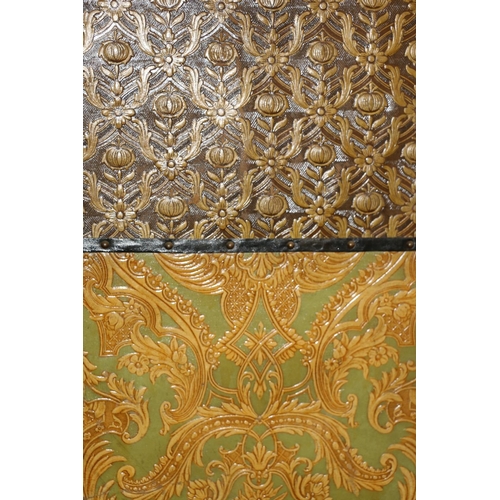 703 - Folding screen with embossed paper decoration, 175cm high.