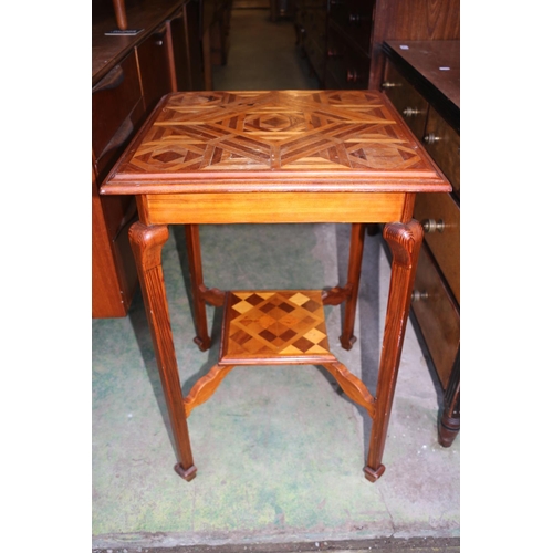 707 - Inlaid marquetry two-tier occasional table decorated in geometric design, 72cm high.