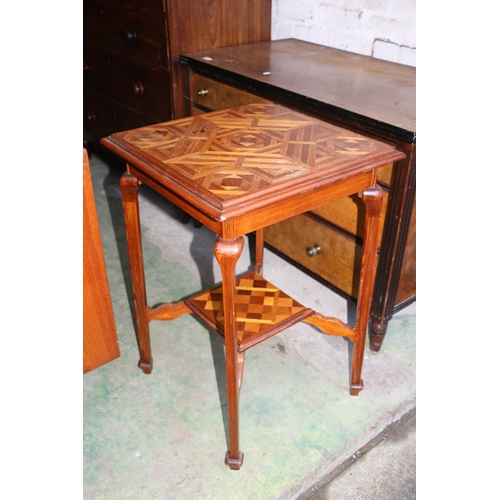 707 - Inlaid marquetry two-tier occasional table decorated in geometric design, 72cm high.