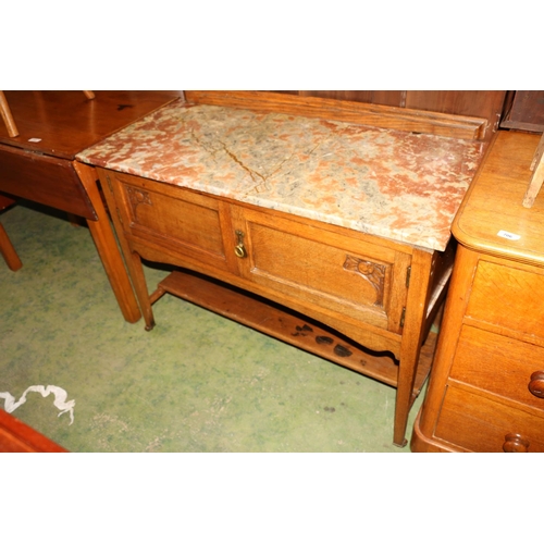 708 - Early 20th century marble top washstand with cupboard underneath.