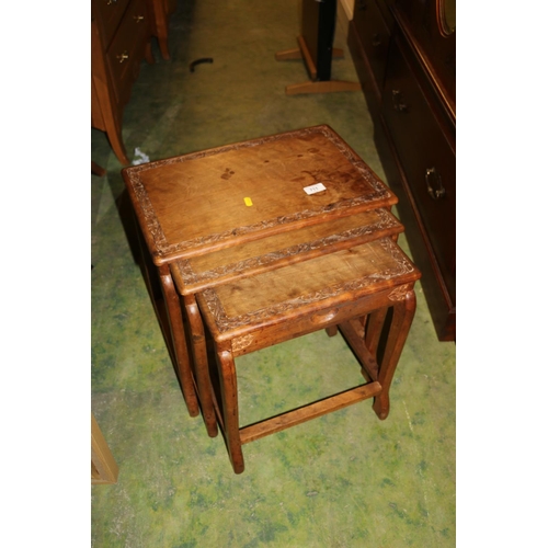 711 - Nest of three oriental teak tables, 46cm high.