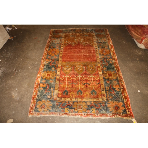 713 - Caucasian wall rug, rust red ground with geometric borders, 200cm x 140cm.