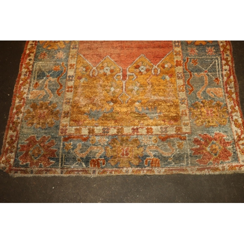 713 - Caucasian wall rug, rust red ground with geometric borders, 200cm x 140cm.