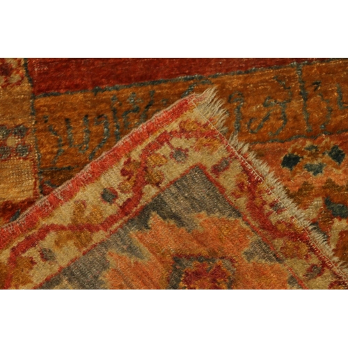 713 - Caucasian wall rug, rust red ground with geometric borders, 200cm x 140cm.