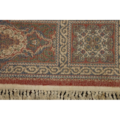 714 - Persian rug, rust red ground with repeating floral scrolls, 190cm x 140cm.