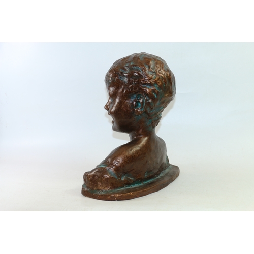 22 - Plaster bust of a young boy having bronzed finish, 33cm high.