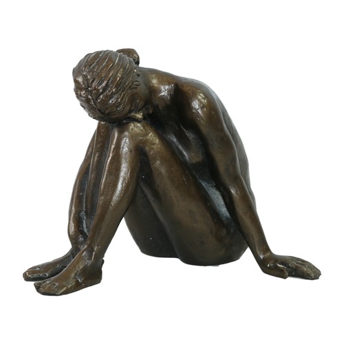 45 - Bronzed composite model of a seated female, 19cm high.