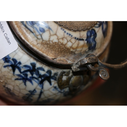 246 - Oriental blue and white pottery pot with metal handle and metal mounts in the form of hanging bats, ... 