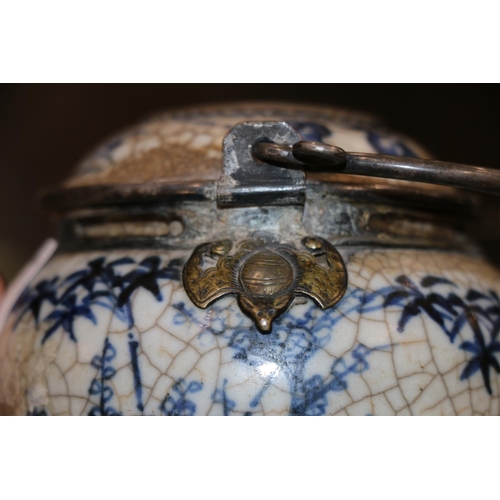 246 - Oriental blue and white pottery pot with metal handle and metal mounts in the form of hanging bats, ... 