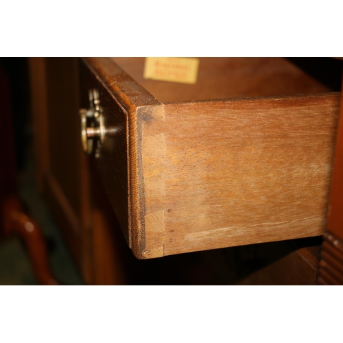 661 - Small oak chest of two short over three long drawers on ball feet, 81cm.