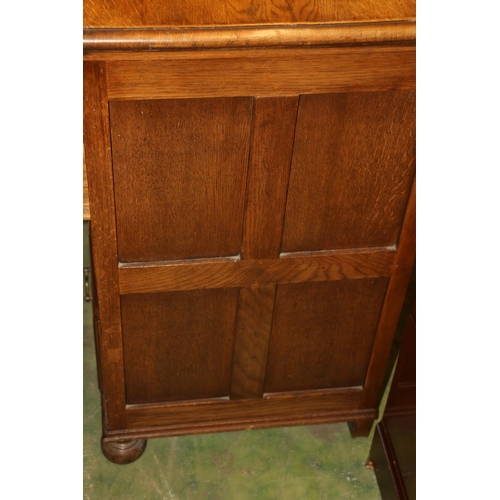 661 - Small oak chest of two short over three long drawers on ball feet, 81cm.