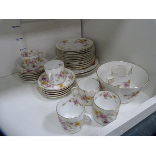 101 - Victorian plates, serving dishes, antique floral decorated part tea set etc (one shelf).