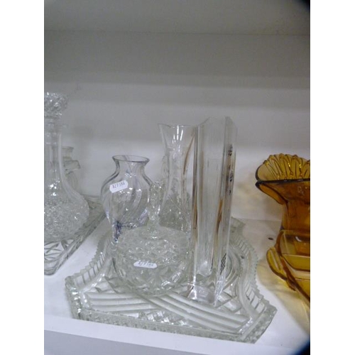 105 - Glassware to include an Art Deco style amber-coloured dressing table items, vases, Caithness glass v... 