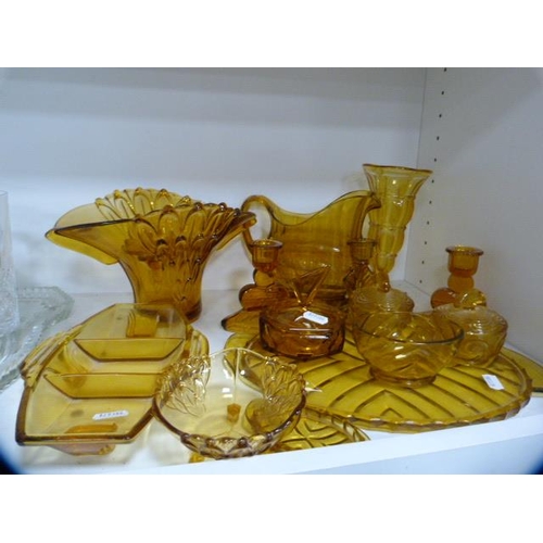 105 - Glassware to include an Art Deco style amber-coloured dressing table items, vases, Caithness glass v... 