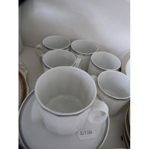 115 - Tea and coffee wares to include Noritake, Royal Worcester and others (one shelf).