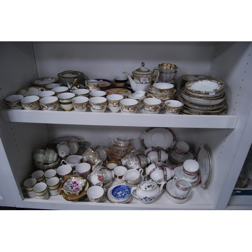 125 - Large quantity of miscellaneous teawares to include Noritake, Tuscan etc (two shelves).