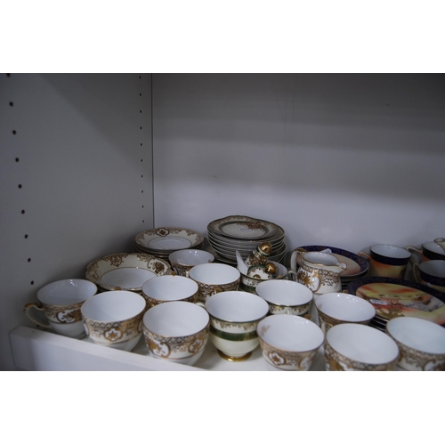 125 - Large quantity of miscellaneous teawares to include Noritake, Tuscan etc (two shelves).