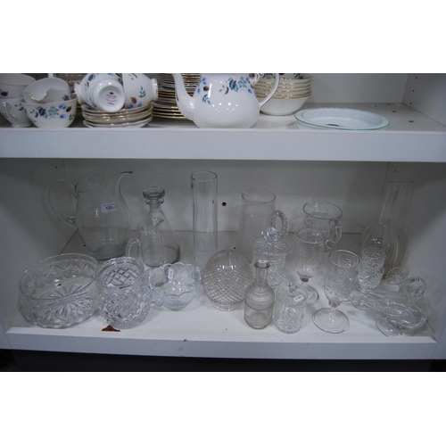 133 - Glassware to include jugs, kitchenalia, crystal bowl, crystal glasses, etched vases etc (one shelf).