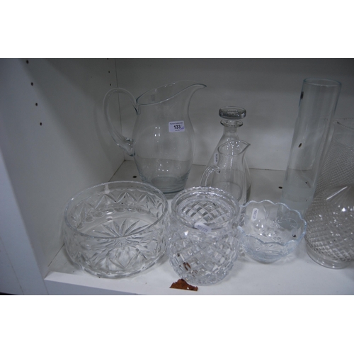 133 - Glassware to include jugs, kitchenalia, crystal bowl, crystal glasses, etched vases etc (one shelf).