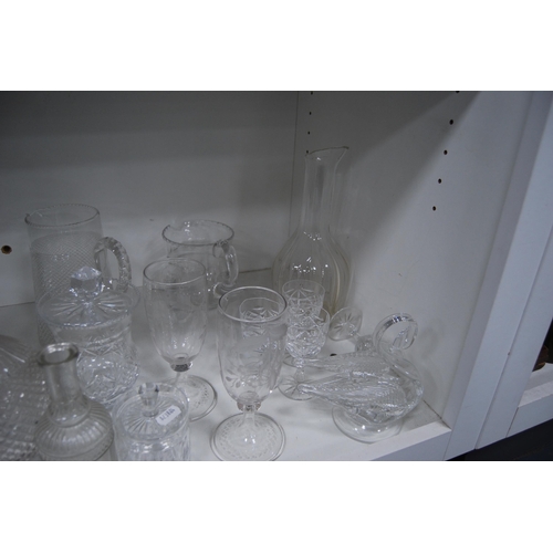 133 - Glassware to include jugs, kitchenalia, crystal bowl, crystal glasses, etched vases etc (one shelf).