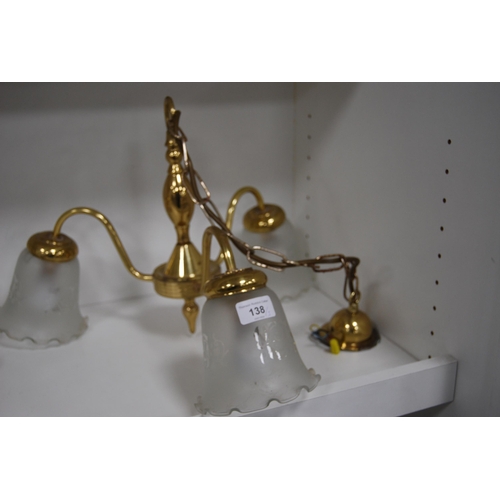 138 - Three modern gilt ceiling lights with glass shades.