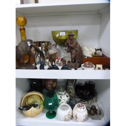 142 - Bric-a-brac to include glass vases, hip flasks, Carlton Ware, harmonicas, ginger jars, oriental wood... 