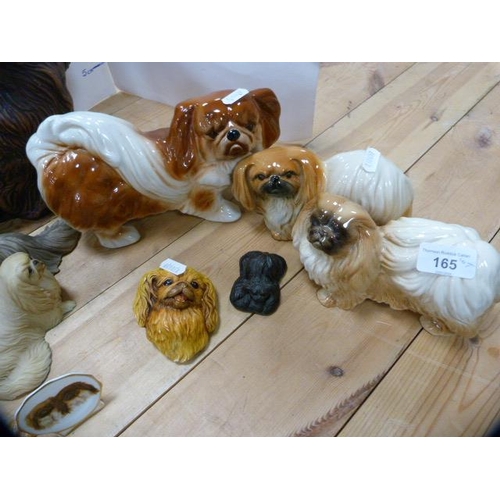 165 - Group of ceramic and resin spaniel figures to include examples by Beswick.