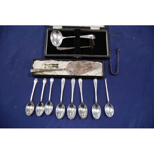 180 - Group of silver flatware to include sugar spoons, spoon and push and a cake knife, approximately 159... 