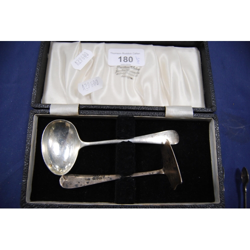 180 - Group of silver flatware to include sugar spoons, spoon and push and a cake knife, approximately 159... 