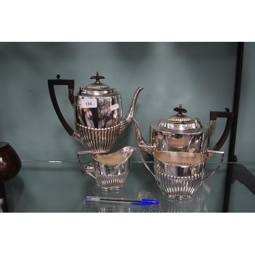 186 - Walker & Hall EP four-piece tea set, monogrammed, with gadrooned decoration.  (4)