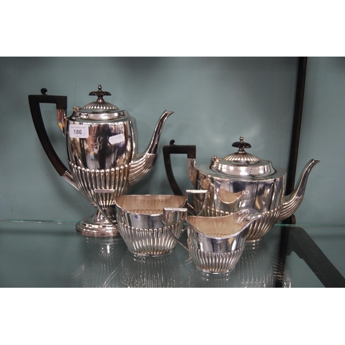 186 - Walker & Hall EP four-piece tea set, monogrammed, with gadrooned decoration.  (4)