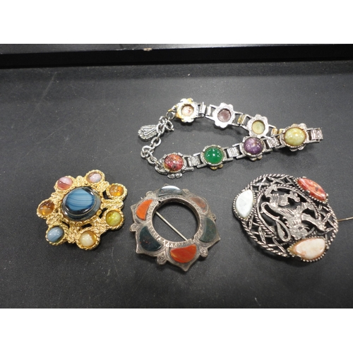 191 - Bag containing miscellaneous brooches to include a Scottish silver agate example and others, similar... 