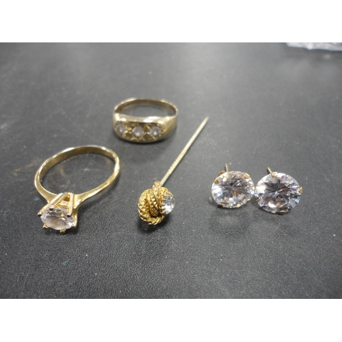 206 - 9ct gold dress ring, 2.95g gross, a stick pin, pair of yellow metal earrings and another dress ring.... 