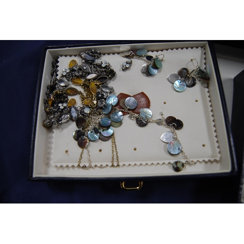 220 - Jewellery box containing assorted costume and silver jewellery to include earrings, chains, bracelet... 