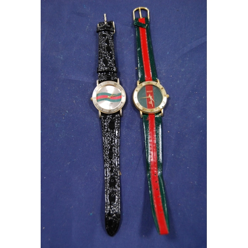 240 - Two Gucci gent's quartz wristwatches.