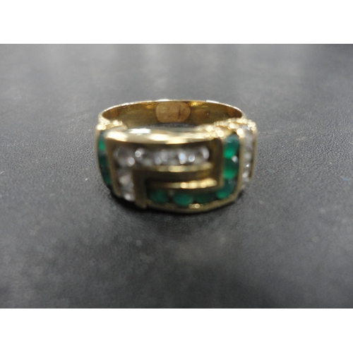 250 - Dress ring with emerald-style and diamond-style stones.