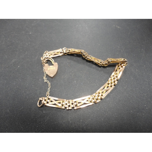 254 - 9ct gold padlock on chain.