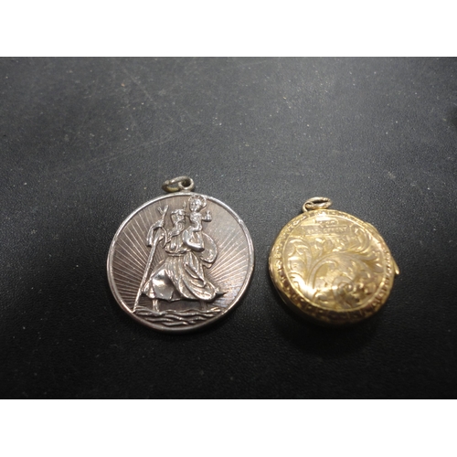 259 - Silver St Christopher pendant and a rolled gold locket.