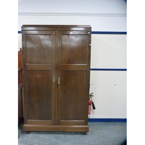 268 - Mahogany two-door wardrobe.