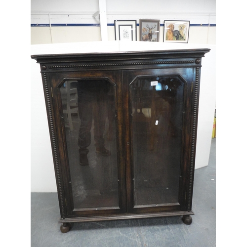 275 - Oak glazed two-door bookcase.