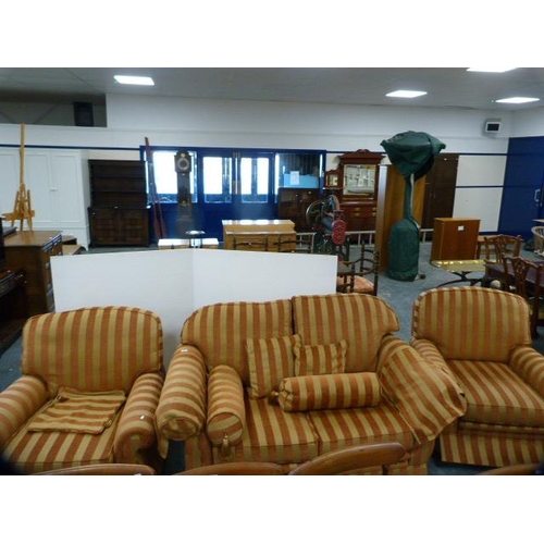 286 - Three-piece upholstered lounge suite comprising a two-seater sofa and a pair of armchairs with cushi... 