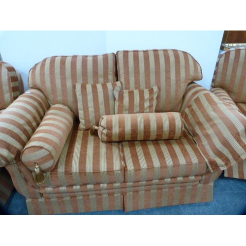 286 - Three-piece upholstered lounge suite comprising a two-seater sofa and a pair of armchairs with cushi... 