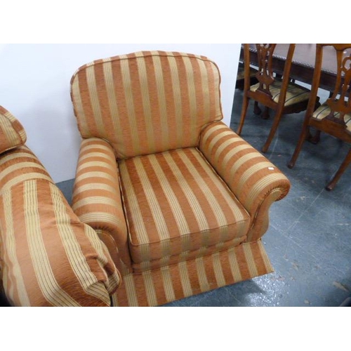 286 - Three-piece upholstered lounge suite comprising a two-seater sofa and a pair of armchairs with cushi... 